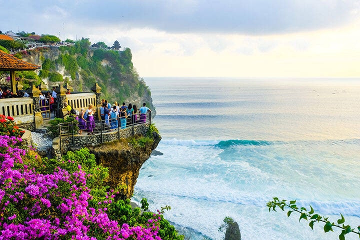 Seascape, ocean at sunset. Ocean coast with waves near Uluwatu temple at sunset, Bali, Indonesia.